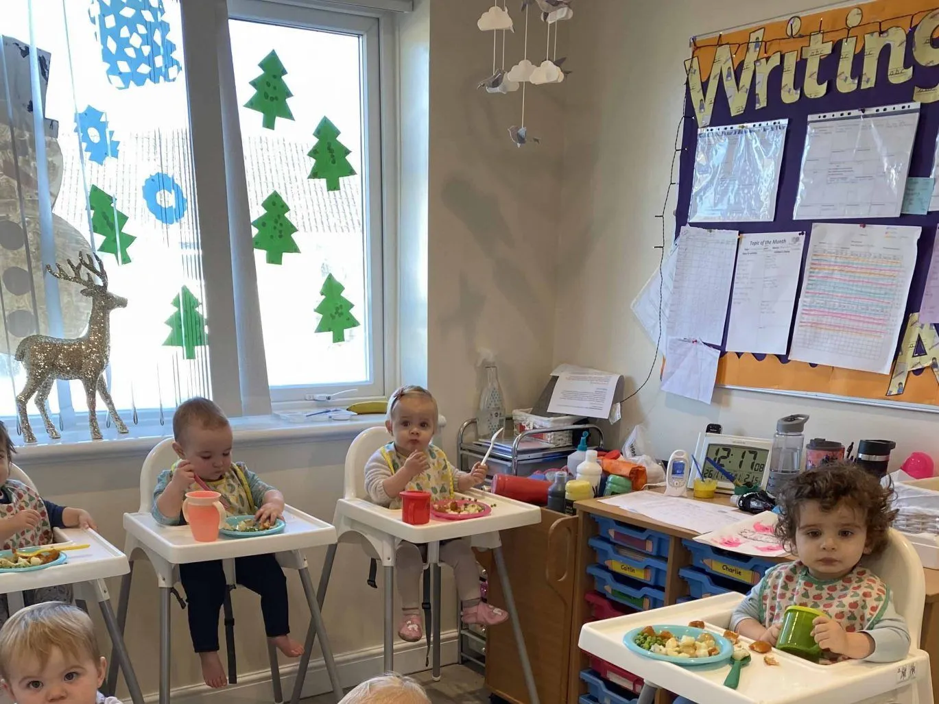 Children sitting together at mealtime in the nursery at Ready Steady Go Childcare Worle
