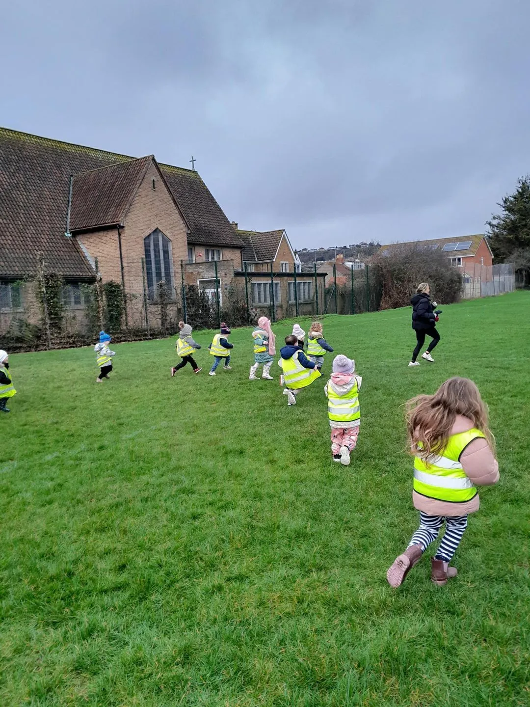 Preschool children running on the recreational ground beside the Ready Steady Go preschool in Milton